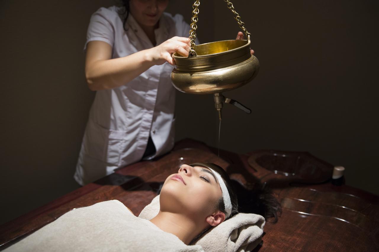 Gabala Garden Hotel Buitenkant foto A woman receiving a head massage